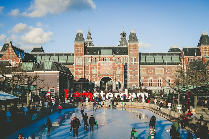 Amsterdam Day Trip from Brussels With Cheese, Clogs and Windmills - Canal-side streets and the guided walk style you should expect