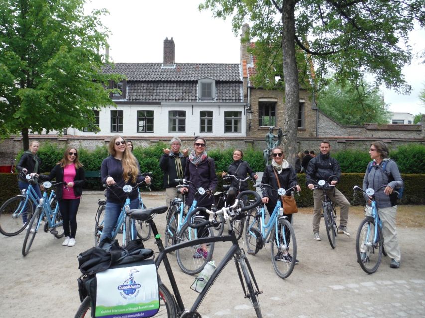 Bruges: Guided Bike Tour with a Local to Sights & Secrets - Market Square and the Belfry, seen at cycling speed