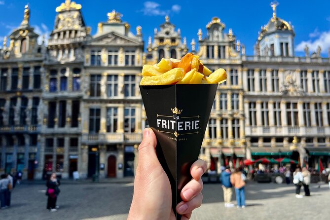 Brussels Food Tour: 10 Tastings of Waffles, Beers, Fries & More - Stop 1: A Fast Start at Auguste Orts Statue