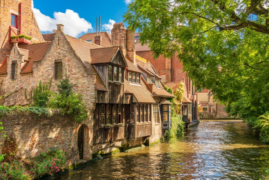 From Amsterdam: Bruges Day Trip in Spanish with Boat Option - Key Highlights That Make This Worth Your Time