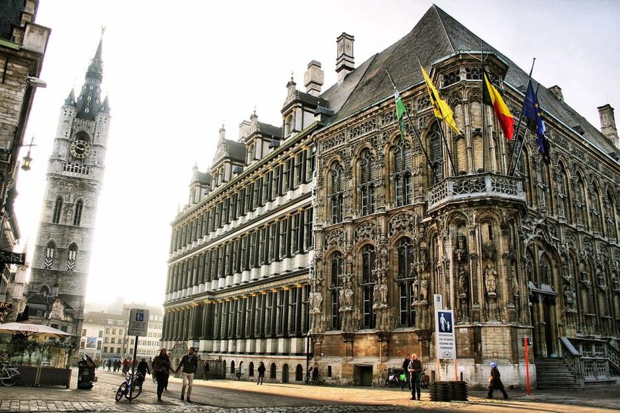 Ghent: Guided Walking Tour and Canal Boat Trip - Belfort and Town Hall Area: The Power Center in One Block