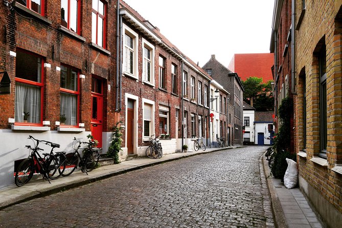 Private Day Trip from Brussels to Bruges - Walplein: Sculptures, Cafes Under Trees, and Easy Slowing Down