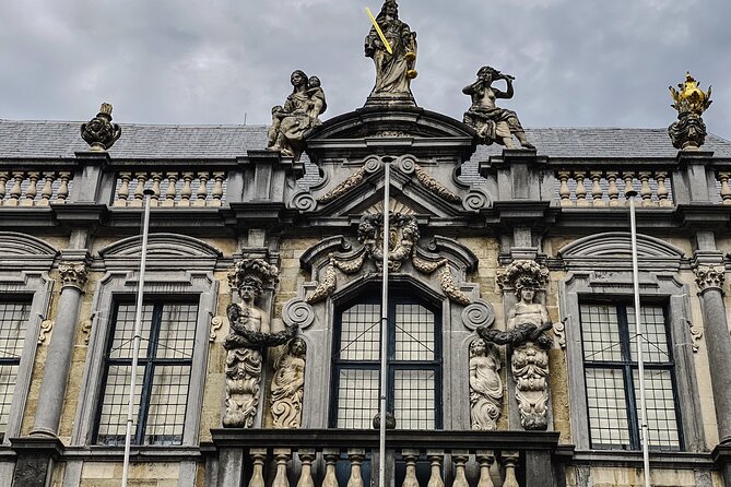 Secrets of Bruges: Walking Tour With a Chocolate and Waffle Bite - Canal walk with romance details, then Gruut House and two famous bridges